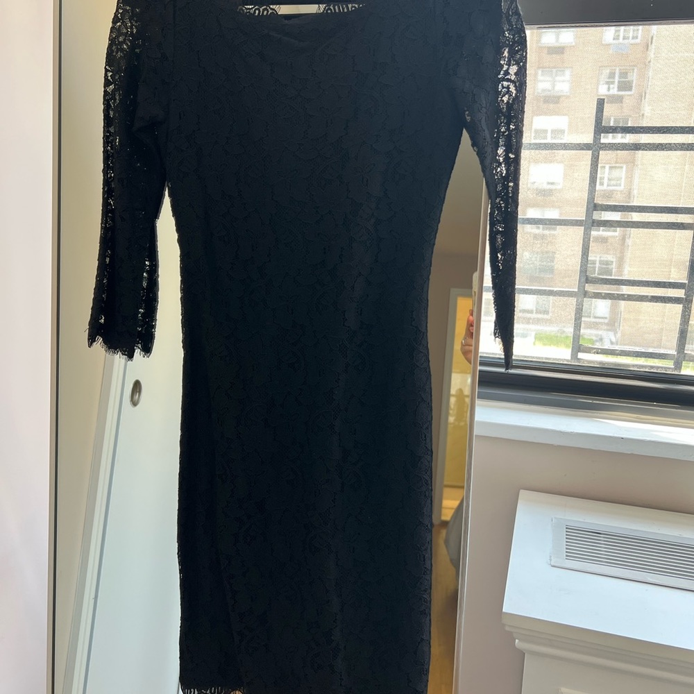 Black lace DVF mid length cocktail dress. Never been worn! Like new.